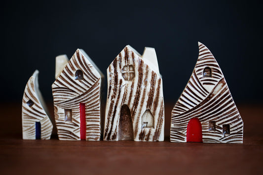 Textured Ceramic Houses with Red Doors and a Cat in Window