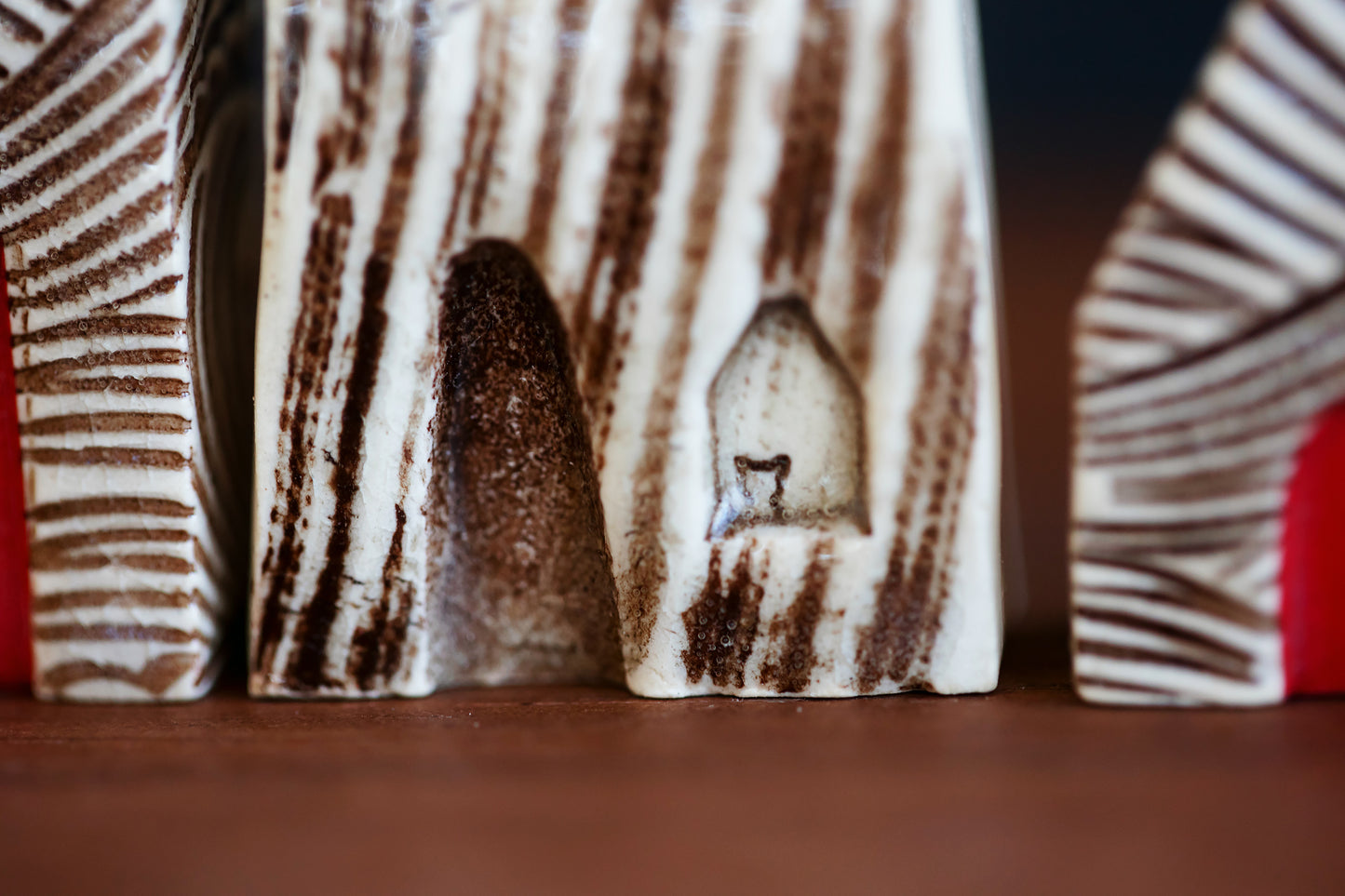 Textured Ceramic Houses with Red Doors and a Cat in Window