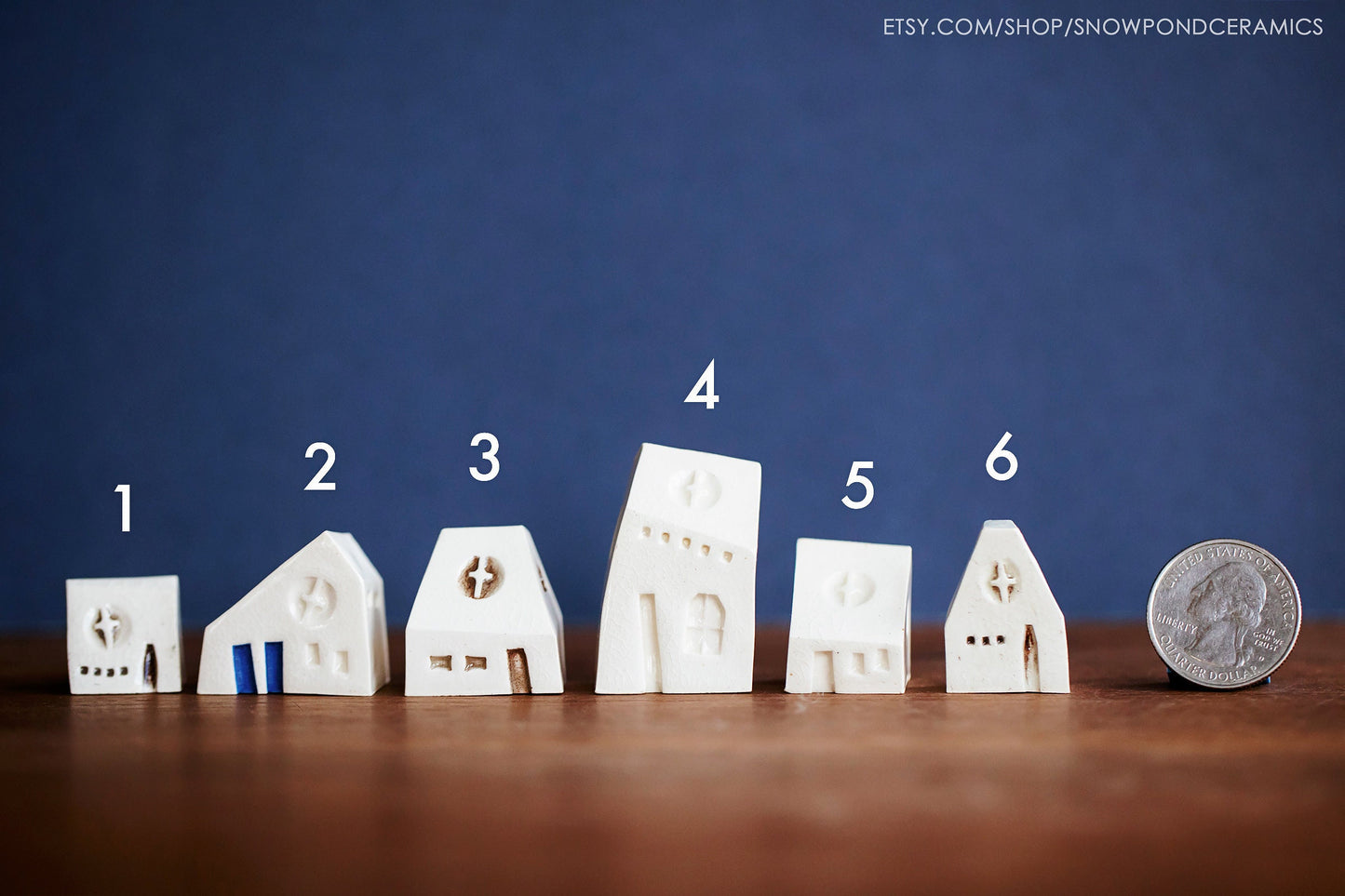 Miniature ceramic white church with different doors and windows.