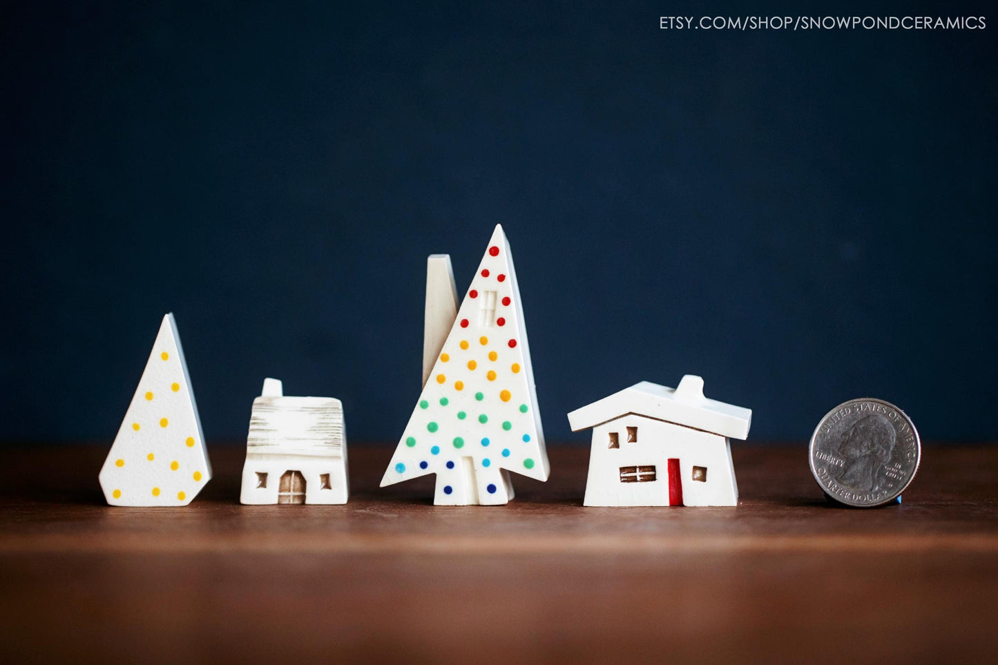 Mini rainbow ceramic Christmas tree with tiny houses.