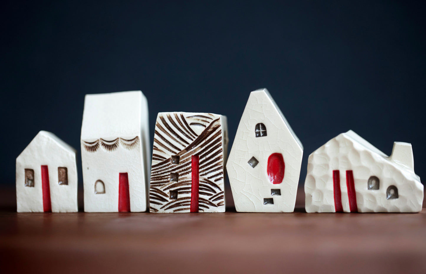 Artsy Ceramic Village with Red Doors and Cat in Window