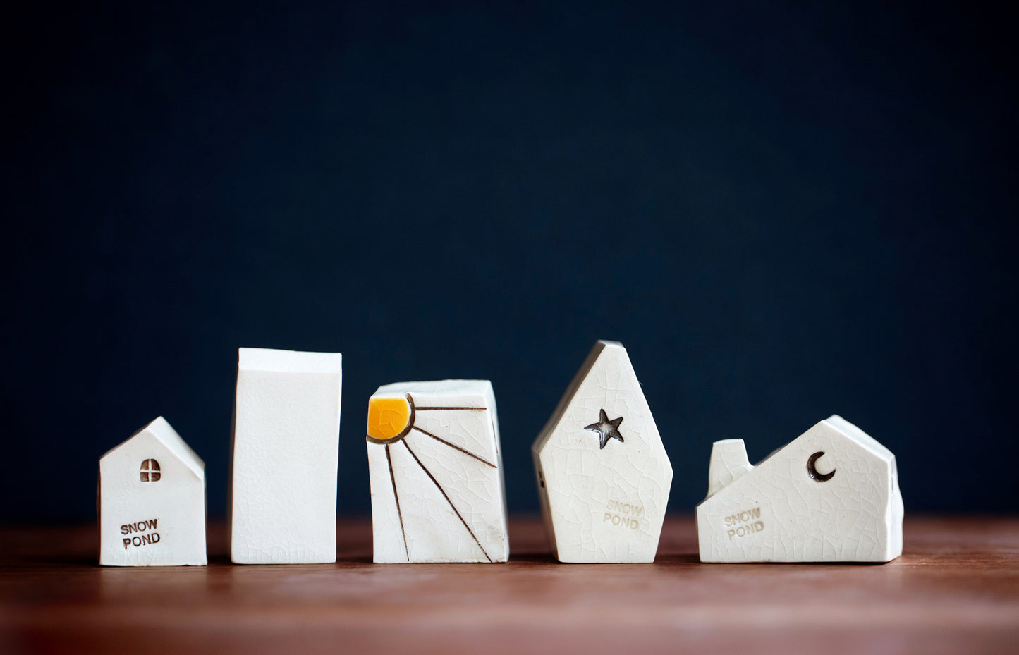 Artsy Ceramic Village with Red Doors and Cat in Window