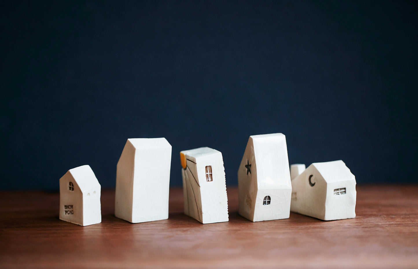 Artsy Ceramic Village with Red Doors and Cat in Window