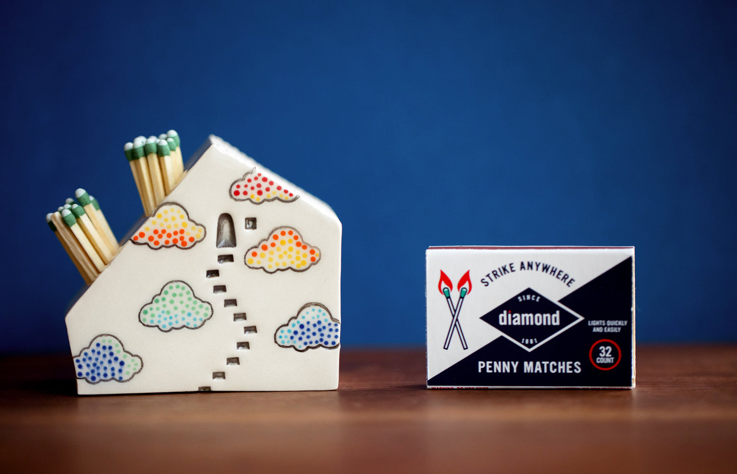 Whimsical Cloud Rainbows Match Striker with Tiny Cat Mantle Decor