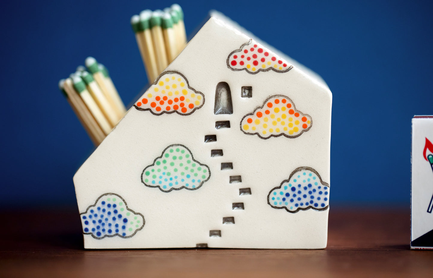 Whimsical Cloud Rainbows Match Striker with Tiny Cat Mantle Decor