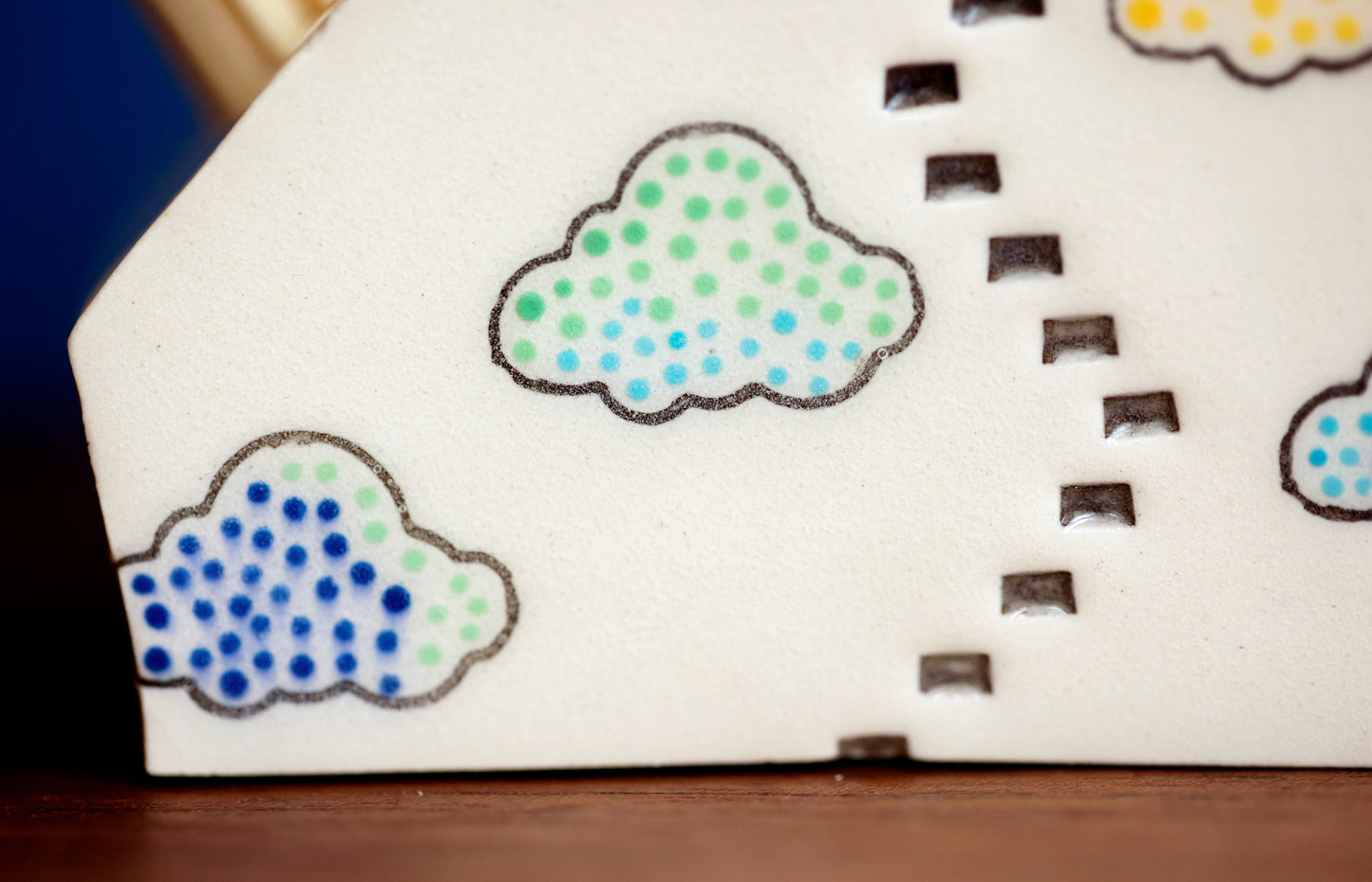 Whimsical Cloud Rainbows Match Striker with Tiny Cat Mantle Decor