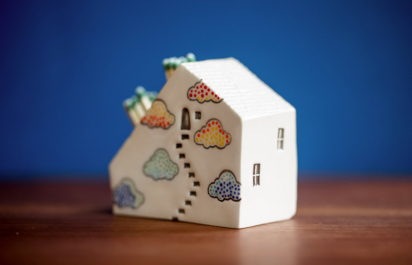 Whimsical Cloud Rainbows Match Striker with Tiny Cat Mantle Decor