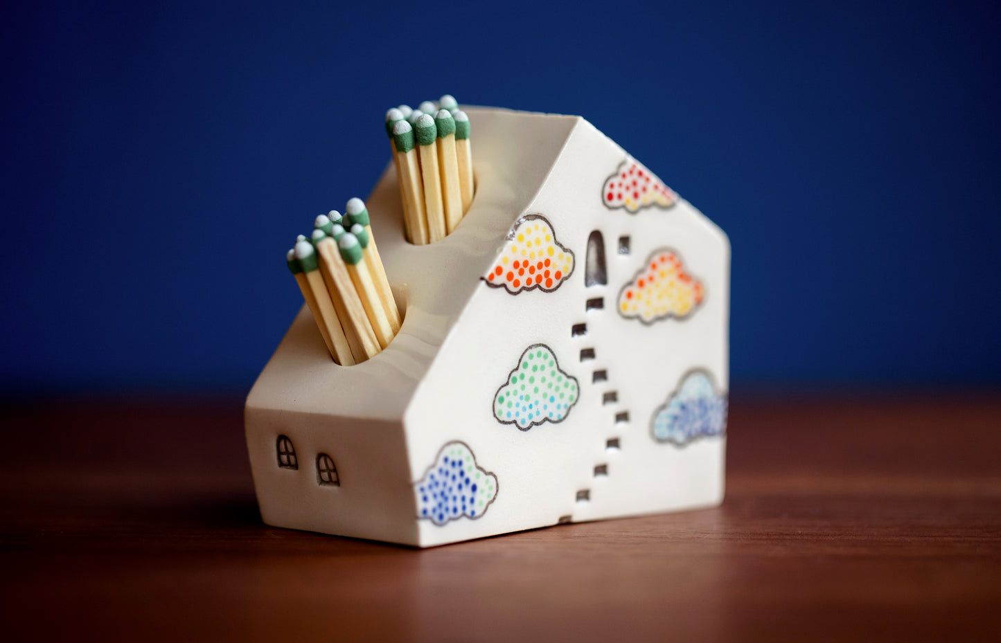 Whimsical Cloud Rainbows Match Striker with Tiny Cat Mantle Decor