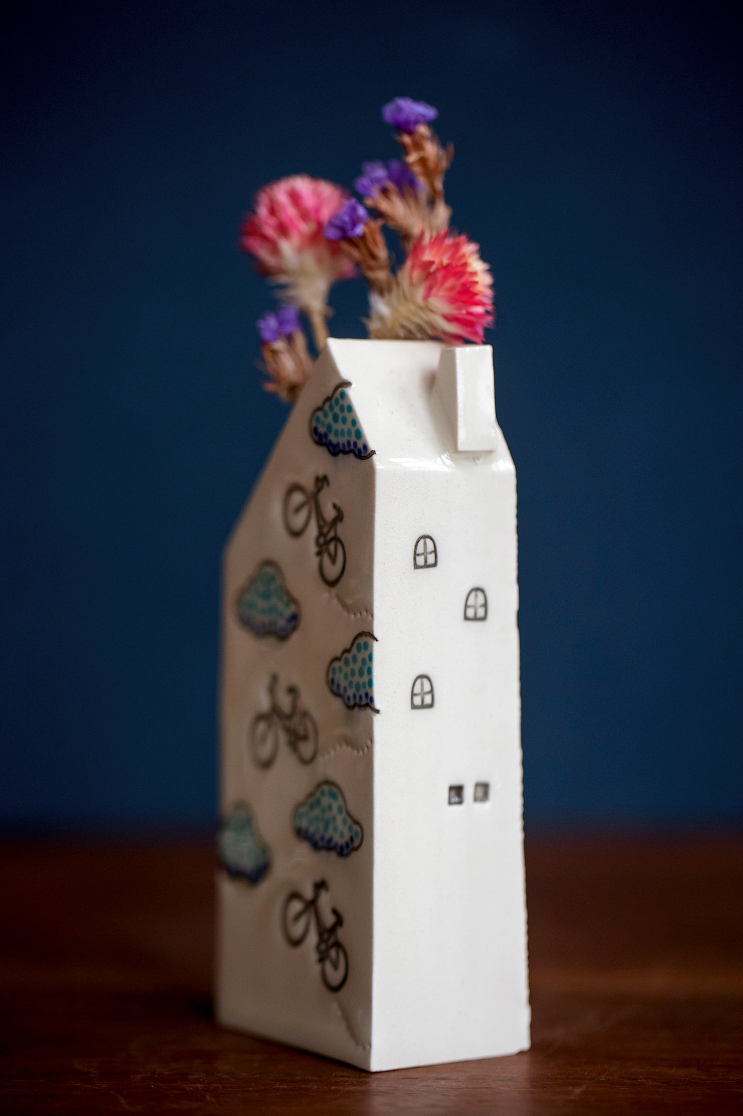 Bud Vase House with Bicycles and Clouds